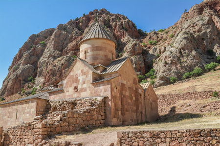 Church and beautiful natural landscape. Monastery in nature. Armenian Church in mount. Beautiful architecture of the church. Monastery against the backdrop of rocky mountains.の写真素材