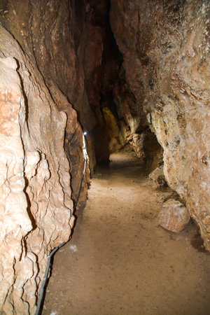 Interior view of a cave with a path leading through it.の写真素材