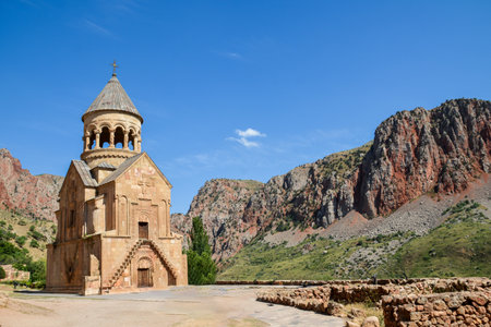 Church and beautiful natural landscape. Monastery in nature. Armenian Church in mount. Beautiful architecture of the church. Monastery against the backdrop of rocky mountains.の写真素材