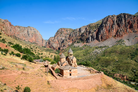 Church and beautiful natural landscape. Monastery in nature. Armenian Church Noravank. Beautiful architecture of the church. Monastery against the backdrop of rocky mountains.の写真素材