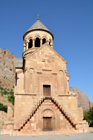 Church and beautiful natural landscape. Monastery in nature. Armenian Church Noravank. Beautiful architecture of the church. Monastery against the backdrop of rocky mountains.の写真素材