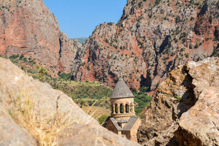 Church and beautiful natural landscape. Monastery in nature. Armenian Church Noravank. Beautiful architecture of the church. Monastery against the backdrop of rocky mountains.の写真素材