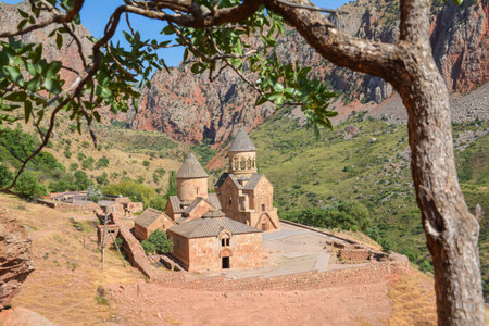 Church and beautiful natural landscape. Monastery in nature. Armenian Church Noravank. Beautiful architecture of the church. Monastery against the backdrop of rocky mountains.の写真素材
