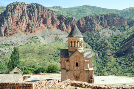 Church and beautiful natural landscape. Monastery in nature. Armenian Church Noravank. Beautiful architecture of the church. Monastery against the backdrop of rocky mountains.の写真素材