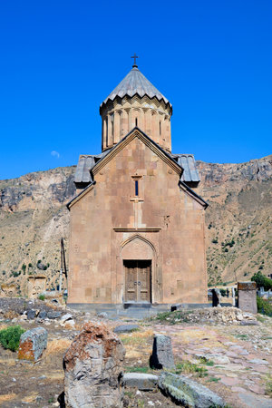 Church and beautiful natural landscape. Monastery in nature. Armenian Church Noravank. Beautiful architecture of the church. Monastery against the backdrop of rocky mountains.の写真素材