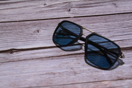 Sunglasses on a wooden background. Selective focus. nature.の写真素材