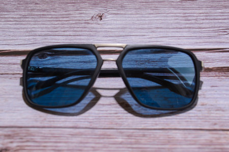 Sunglasses on a wooden background. Selective focus. nature.の写真素材