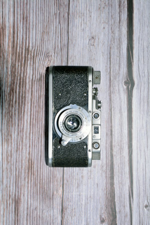 Vintage camera on a wooden background. Retro camera on a wooden background.の写真素材