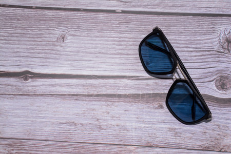 Sunglasses on a wooden background. Selective focus. nature.の写真素材