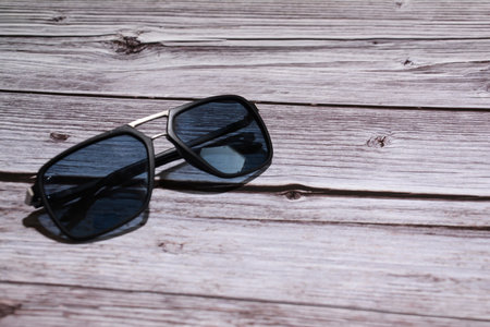 Sunglasses on a wooden background. Selective focus. nature.の写真素材
