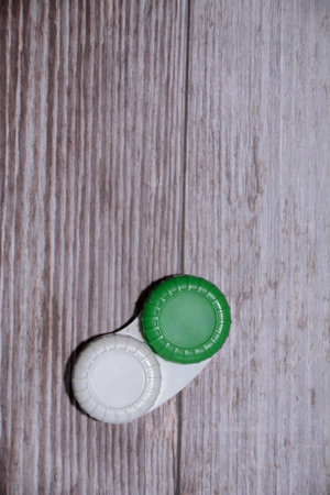 bottle caps on a wooden background, top viewの写真素材