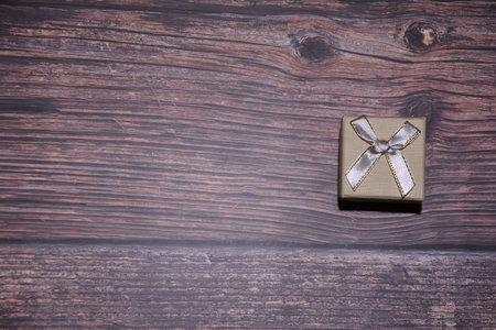 Gift box on wooden background. Selective focus. Holiday.の写真素材