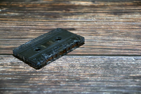 Vintage audio cassette tape on a wooden background. Close up.の写真素材