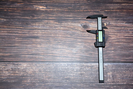 Vernier caliper on wooden background - vintage effect style pictures