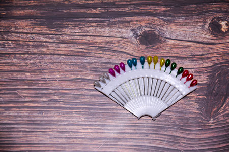 Needles on the table. Needles on a wooden texture backgroundの写真素材