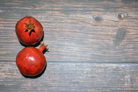 Pomegranates on a wooden background. Pomegranate on a wooden background.の写真素材
