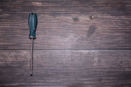 Screwdriver on wooden background. Top view. Copy space.の写真素材