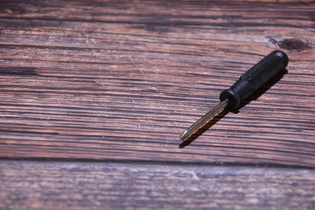 Black key on a wooden background. Close-up. Selective focus.の写真素材