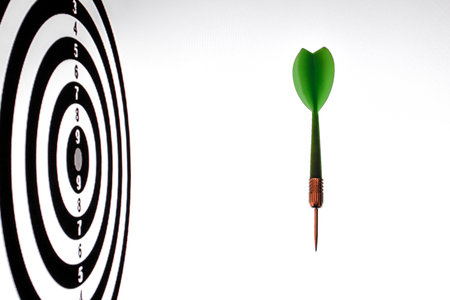 Dartboard with green dart arrow on white background, 3d renderの写真素材