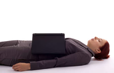 Young woman lies asleep on the floorの写真素材