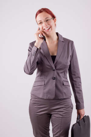 Young woman on the phone with a mobile phoneの写真素材