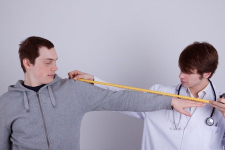 The length of an arm is measured by a doctorの写真素材