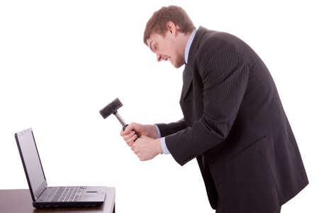 The young business man is destroying his faulty laptop