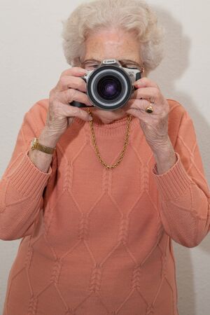 An very old woman with a camera