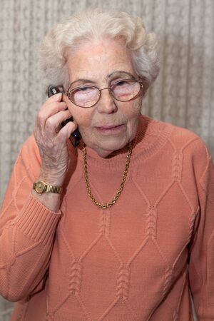 An old woman with a mobile phone