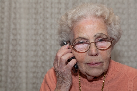An old woman with a mobile phone