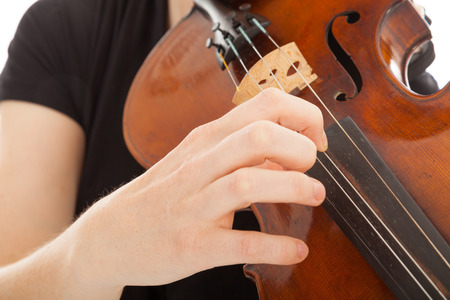The beautiful young woman is playing the violinの写真素材
