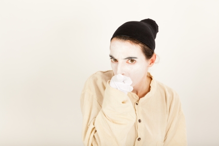 The clown is standing in front of a camera and making a faceの写真素材