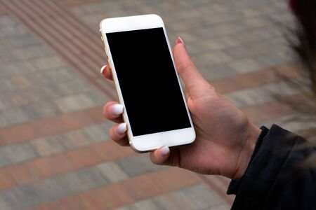 Young woman using her cellphone.の写真素材
