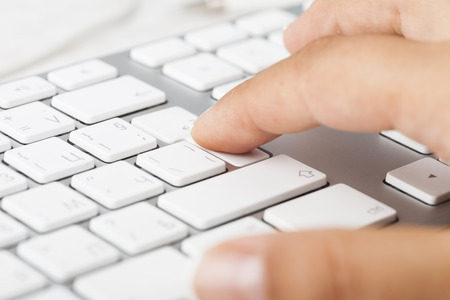 Woman Hand pushing keyboard button