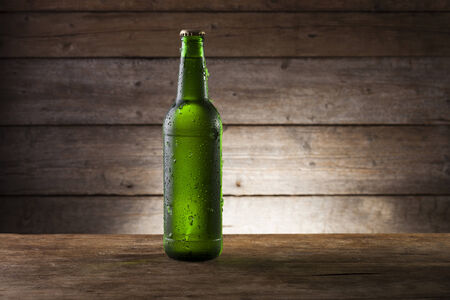 Beer on a wooden background with copyspaceの写真素材