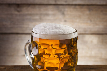 Beer on a wooden background with copyspaceの写真素材