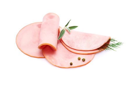 Cooked boiled ham sausage or rolled bologna slices isolated on white background with herbs and spicesの写真素材