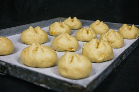 ready to bake bread dough, dough tray, flourの写真素材