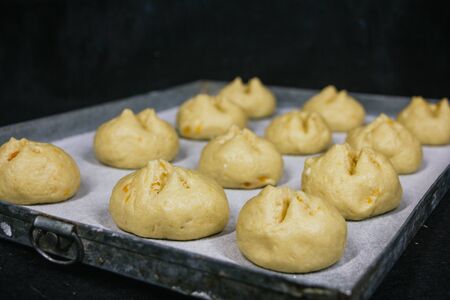 ready to bake bread dough, dough tray, flourの写真素材
