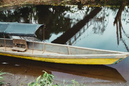 old aboriginal boat on a river in the amazon, ecuadorの写真素材