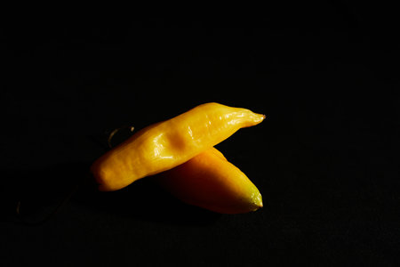 Red hot chili peppers on black backgroundの写真素材