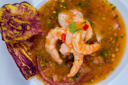 Close up of selective focus in a delicious shrimps of Ecuadorian food: shrimp cebiche in a blurred backgroundの写真素材
