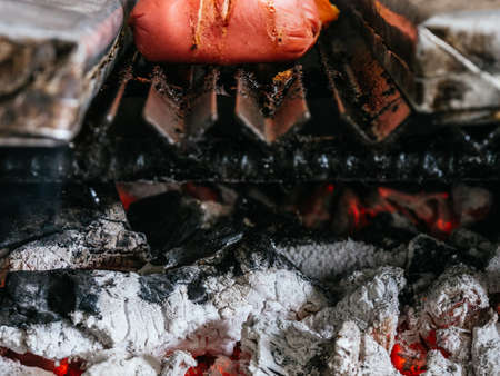 Tomahawk rib beef steak on hot black grill with flamesの写真素材