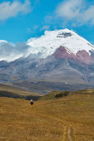 people on horseback in the landscape of the Andes, Cotopaxi Ecuadorの写真素材
