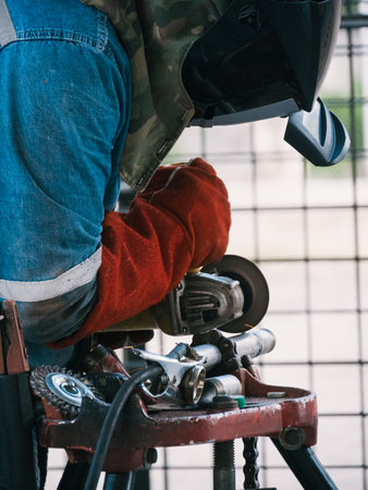 Iron soldering, Man working on iron soldering, welding sparks