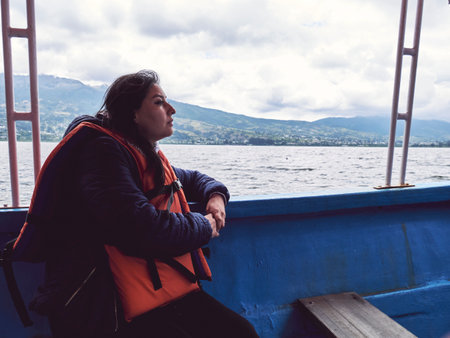 Enjoying a Peaceful Day on the Lake: Woman in a Life Vestの写真素材