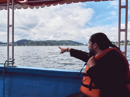 Enjoying a Peaceful Day on the Lake: Man in a Life Vestの写真素材
