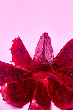 Red dragon fruit Set with appetizing serving Isolated on pink background. Top view, handの写真素材