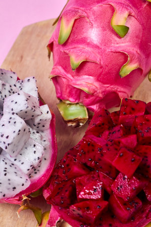 Red dragon fruit Set with appetizing serving Isolated on pink background. Top view, handの写真素材
