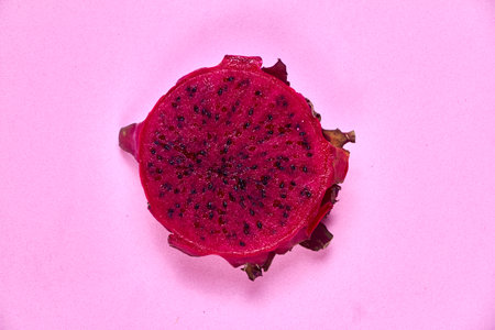 Red dragon fruit Set with appetizing serving Isolated on pink background. Top view, handの写真素材